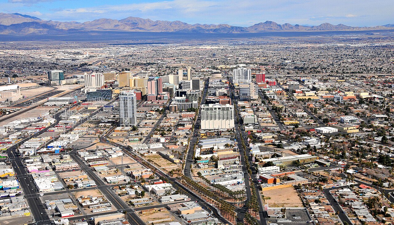 Aerial view of downtown Las Vegas showing streets, buildings, and undeveloped land